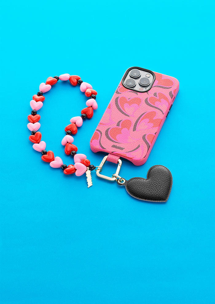 Cover UNTAGS rosa per iPhone 14 con Phone Strap Love e Phone Charm cuore