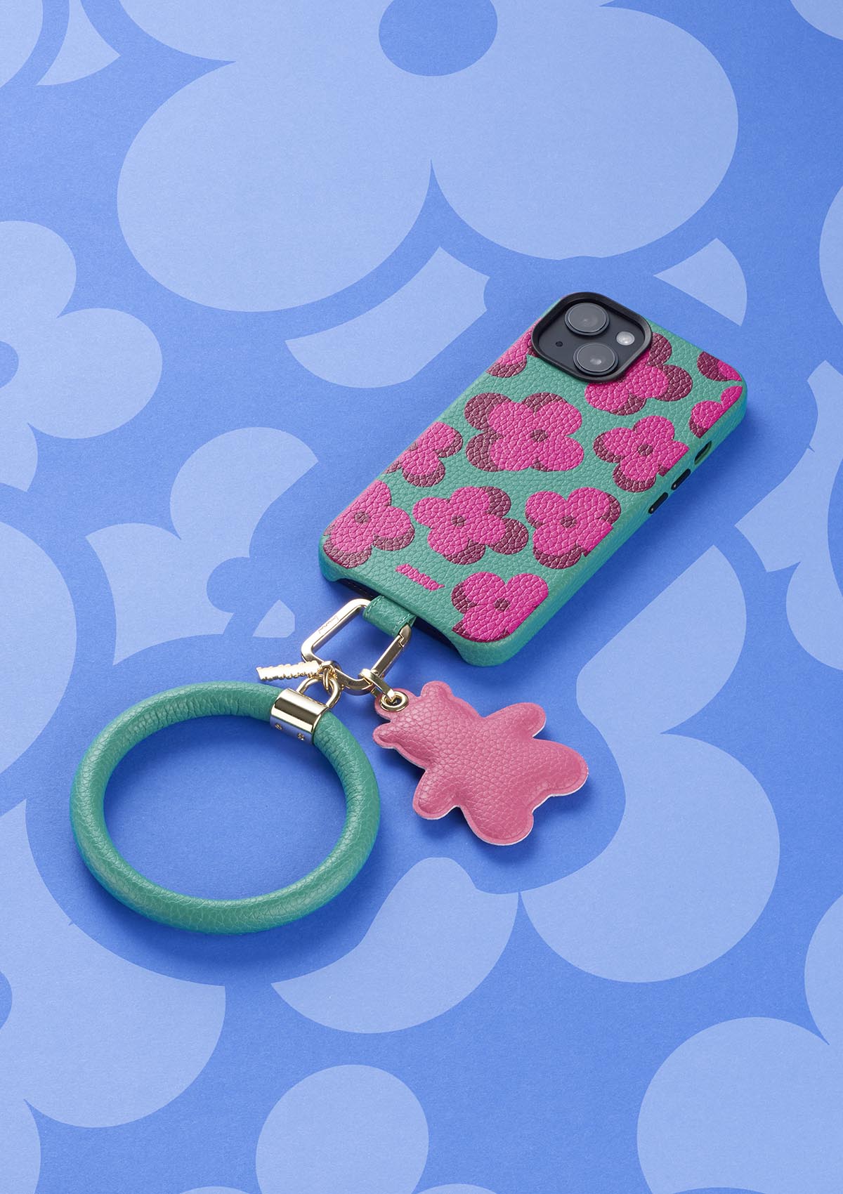 Cover Untags per iPhone 14 Pro Max in colore verde con fiori e accessori Phone Bangle e Phone charm simbolo