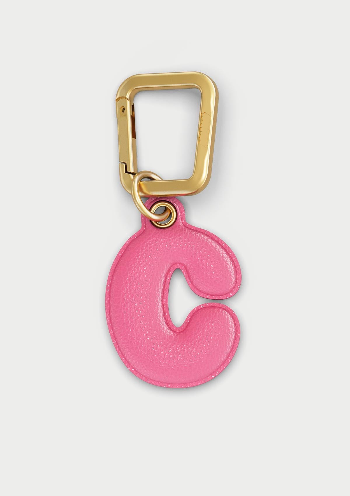 Charm Untags per iPhone a forma di lettera C, effetto pelle in colore rosa, con moschettone per attaccare l’accessorio alla cover