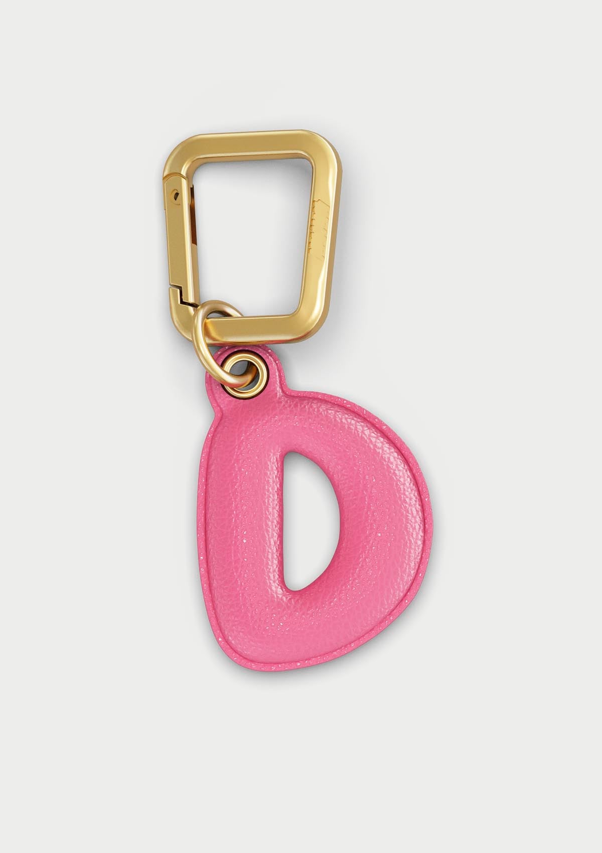 Charm Untags per iPhone a forma di lettera D, effetto pelle in colore rosa, con moschettone per attaccare l’accessorio alla cover