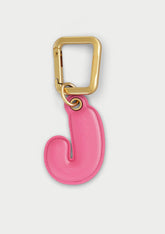 Charm Untags per iPhone a forma di lettera J, effetto pelle in colore rosa, con moschettone per attaccare l’accessorio alla cover