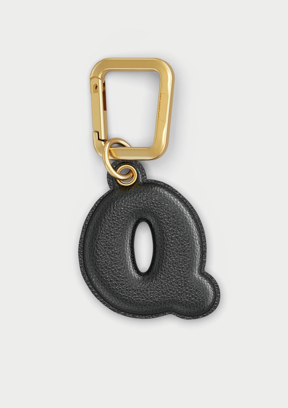 Charm Untags per iPhone a forma di lettera Q, effetto pelle in colore nero, con moschettone per attaccare l’accessorio alla cover