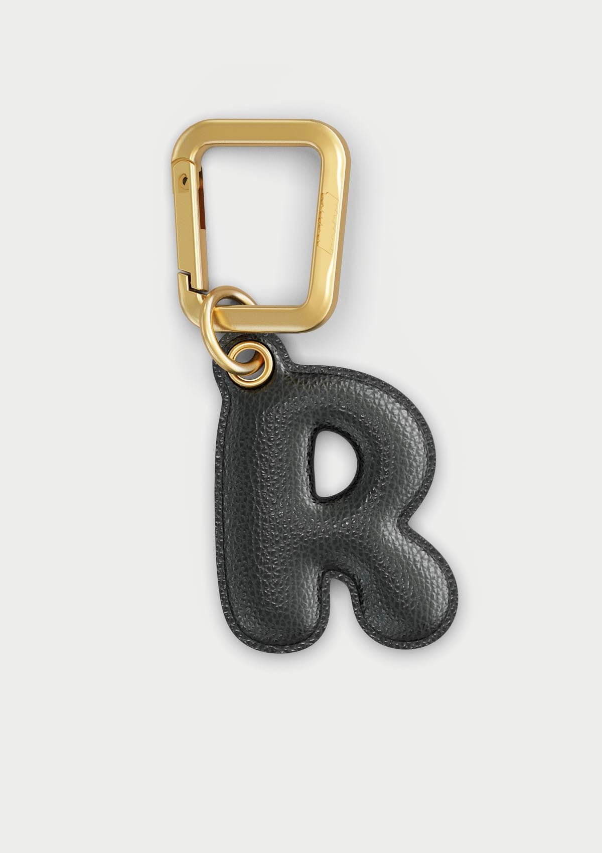 Charm Untags per iPhone a forma di lettera R, effetto pelle in colore nero, con moschettone per attaccare l’accessorio alla cover