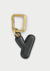 Charm Untags per iPhone a forma di lettera Y, effetto pelle in colore nero, con moschettone per attaccare l’accessorio alla cover
